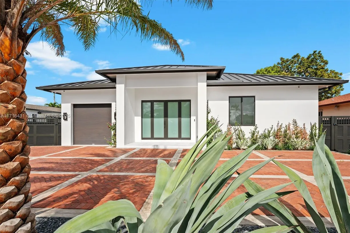South Florida Real Estate | View 715 E 56th St | 4 Beds, 3 Baths