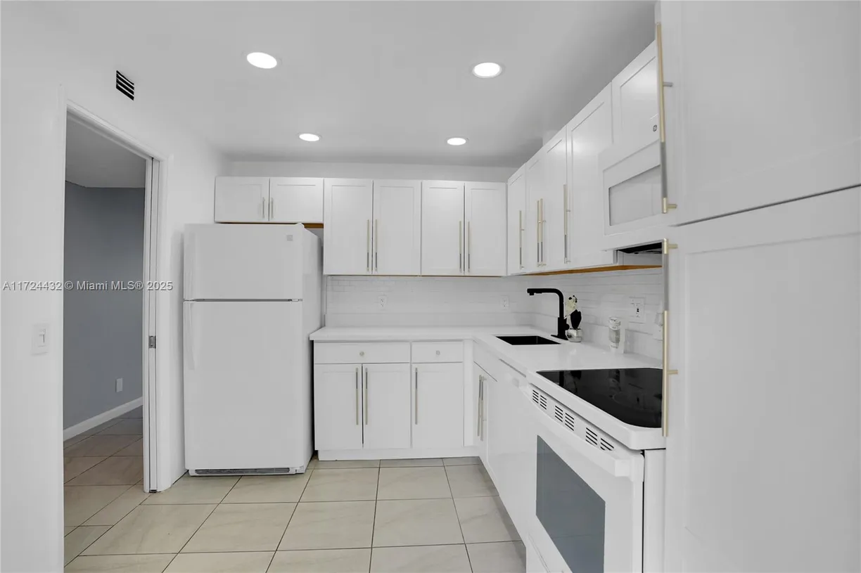 South Florida Real Estate | View 3001 S Course Dr, 105 | Listing