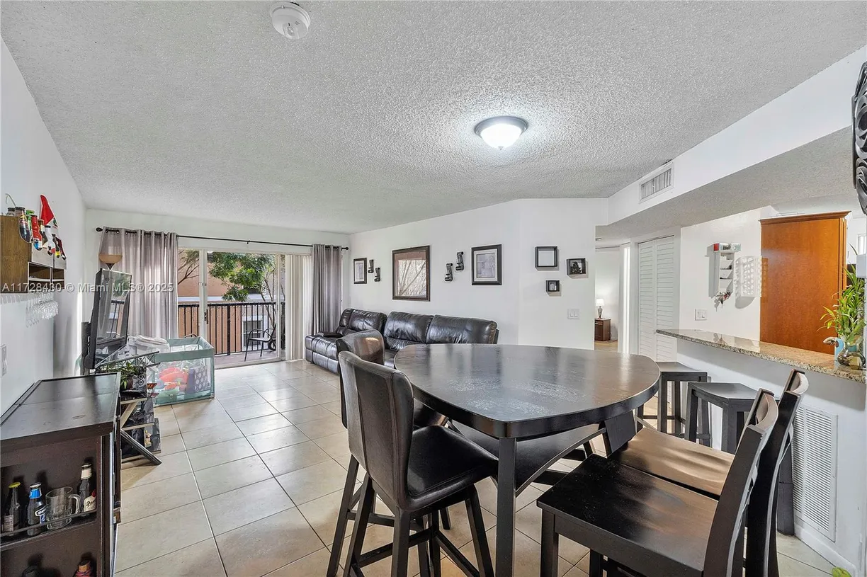 South Florida Real Estate | View 8761 Wiles Rd, 206 | Listing