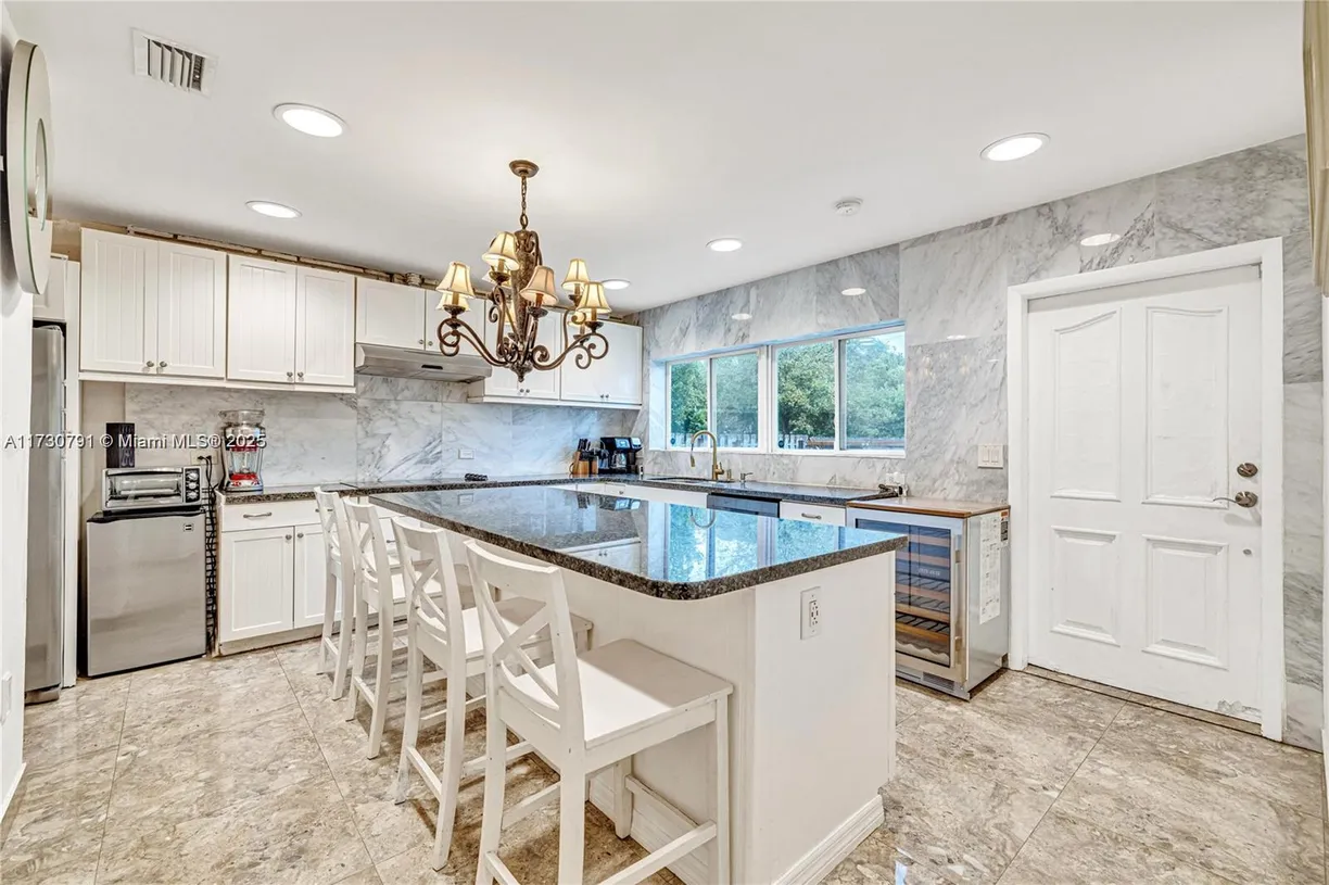 South Florida Real Estate | View 1027 NE 13th | 3 Beds, 2 Baths