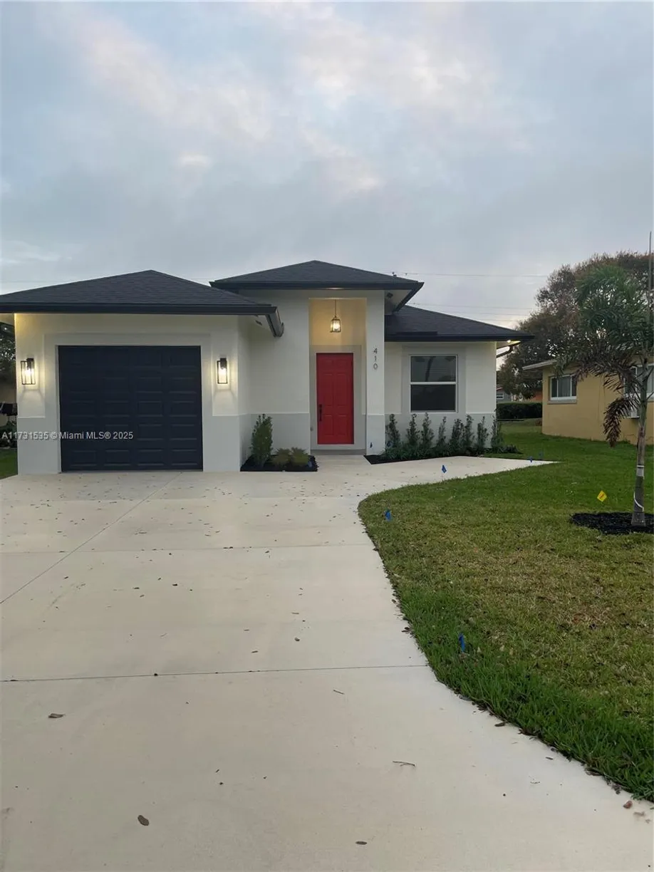 South Florida Real Estate | View 410 NW 8th Ave | 4 Beds, 2 Baths