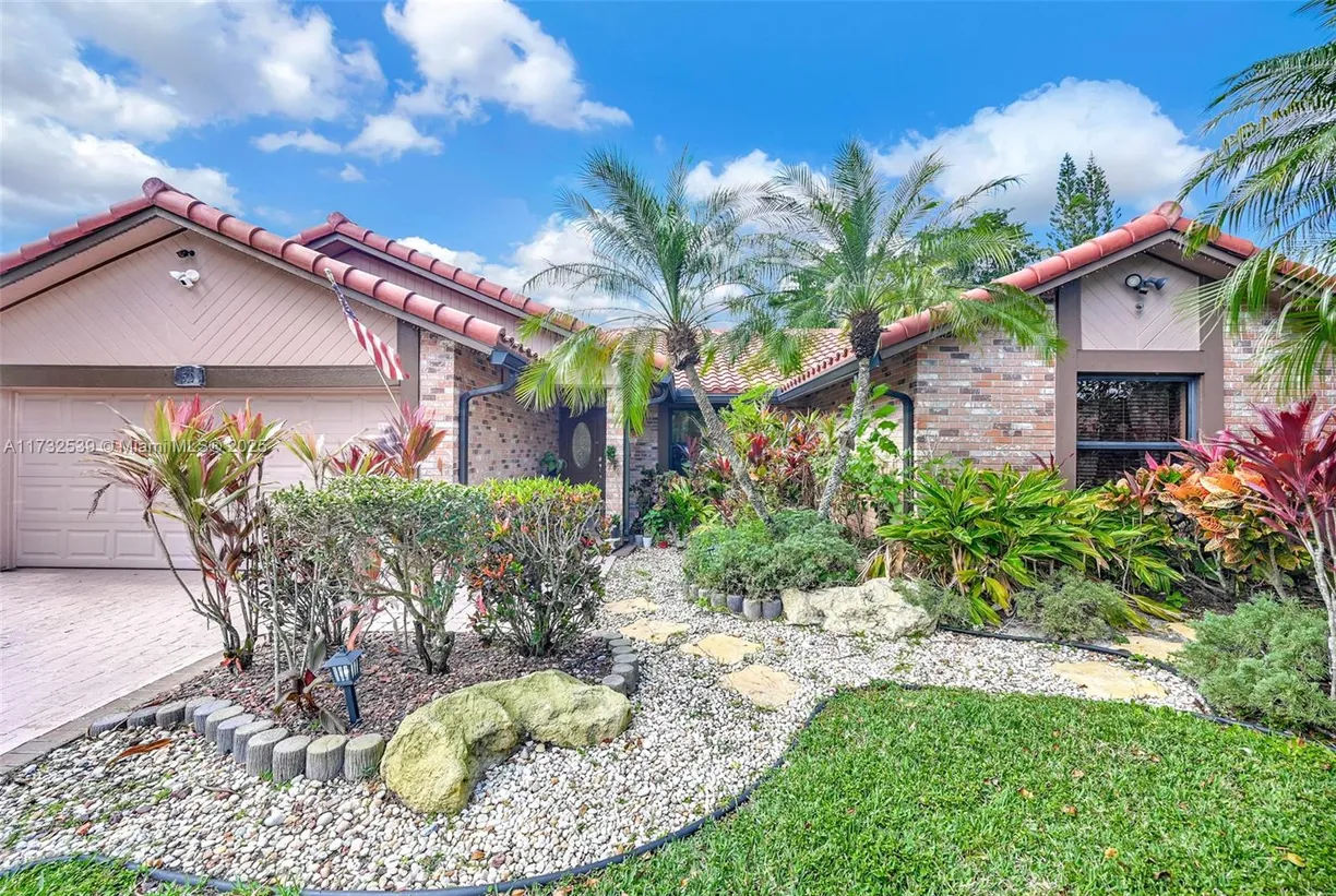 South Florida Real Estate | View 510 NW 105th Dr | 4 Beds, 2 Baths
