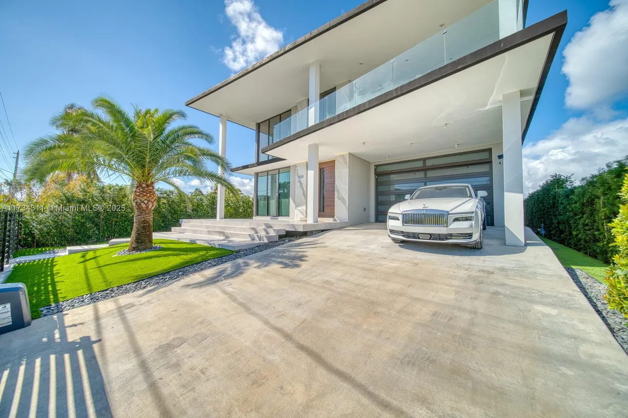 South Florida Real Estate | View 7520 W Treasure Dr | 6 Beds, 6 Baths