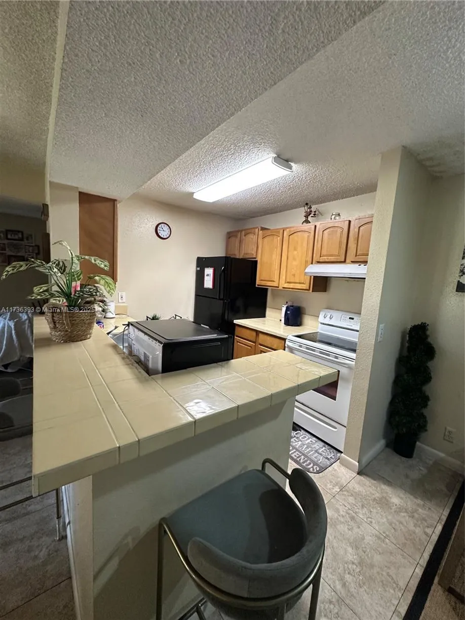 South Florida Real Estate | View 4025 W Mcnab Rd, E208 | Listing