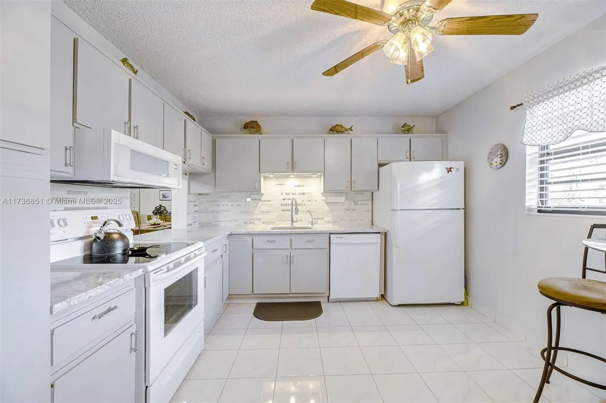 South Florida Real Estate | View 4955 E Sabal Palm Blvd, 305 | Listing