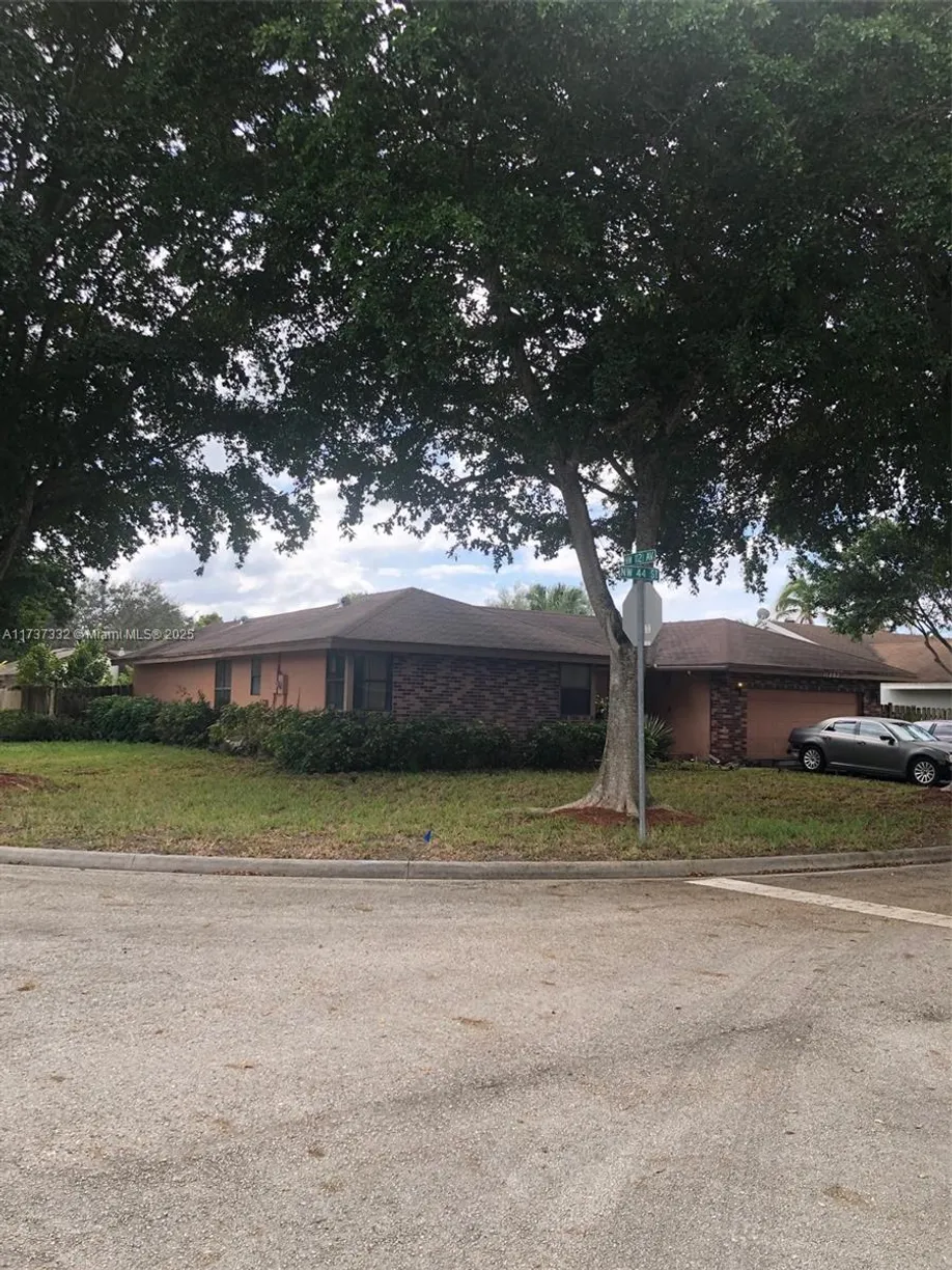 South Florida Real Estate | View 11202 NW 44th St | 4 Beds, 2 Baths
