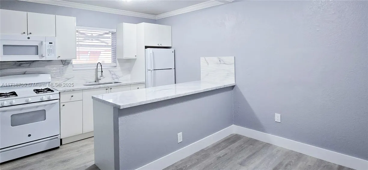 South Florida Real Estate | View 1265 W 24th St, 120 | 2 Beds, 1 Bath