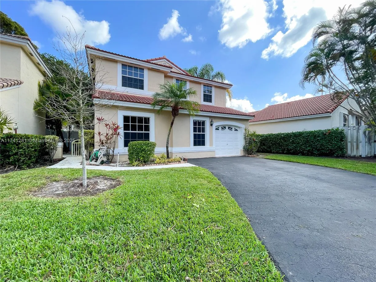 South Florida Real Estate | View 931 Opal Ter | 4 Beds, 2 Baths