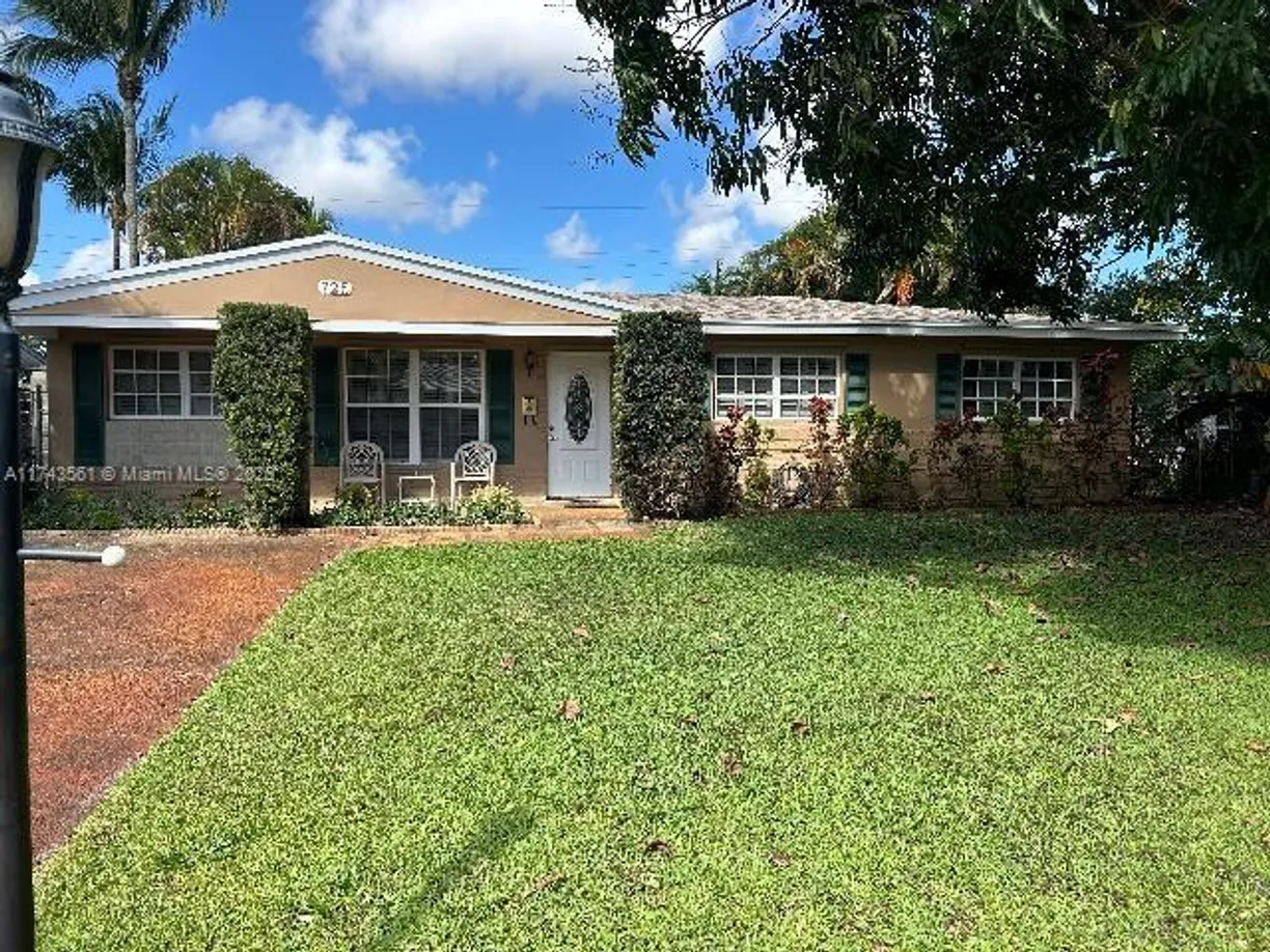 South Florida Real Estate | View 725 NW 30th St | 4 Beds, 2 Baths