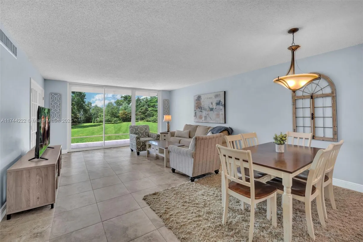 South Florida Real Estate | View 4000 Cypress Grove Way, 210 | 3 Beds, 2 Baths