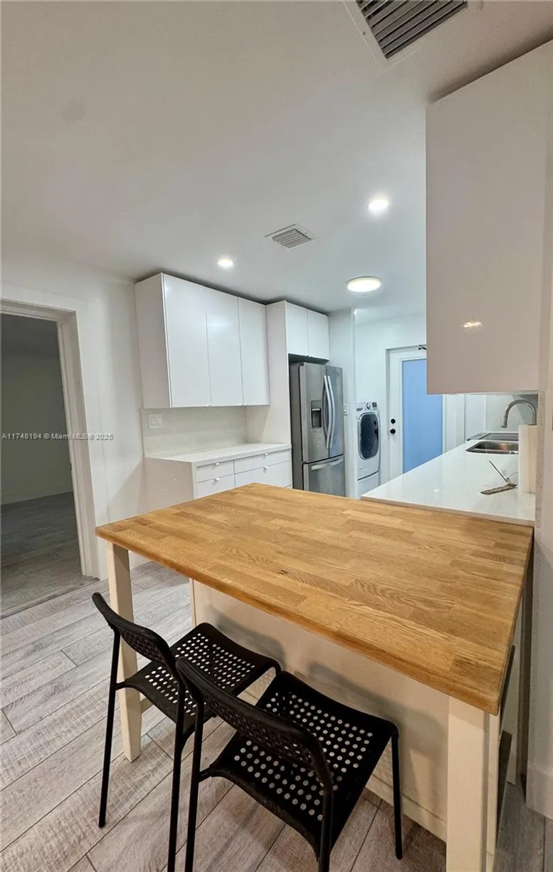 South Florida Real Estate | View 705 W Mango St, C | 3 Beds, 1 Bath