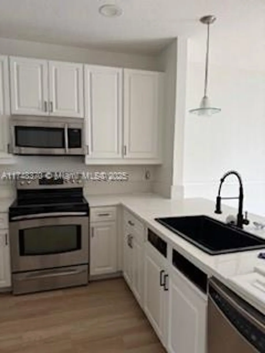 South Florida Real Estate | View 553 NW 39th Cir | Listing