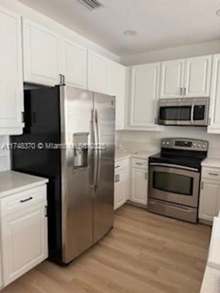 South Florida Real Estate | View 553 NW 39th Cir | 3 Beds, 3 Baths