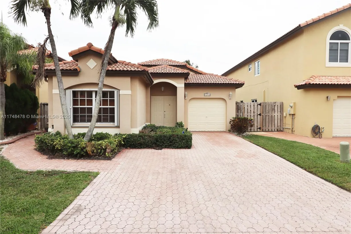 South Florida Real Estate | View 11214 NW 53rd Ln | 3 Beds, 2 Baths