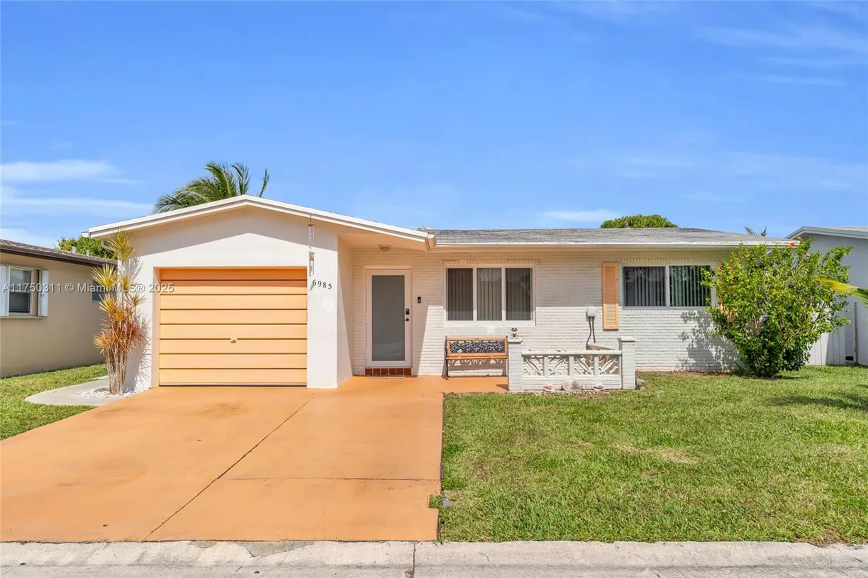 South Florida Real Estate | View 6985 NW 11th Ct | 2 Beds, 2 Baths