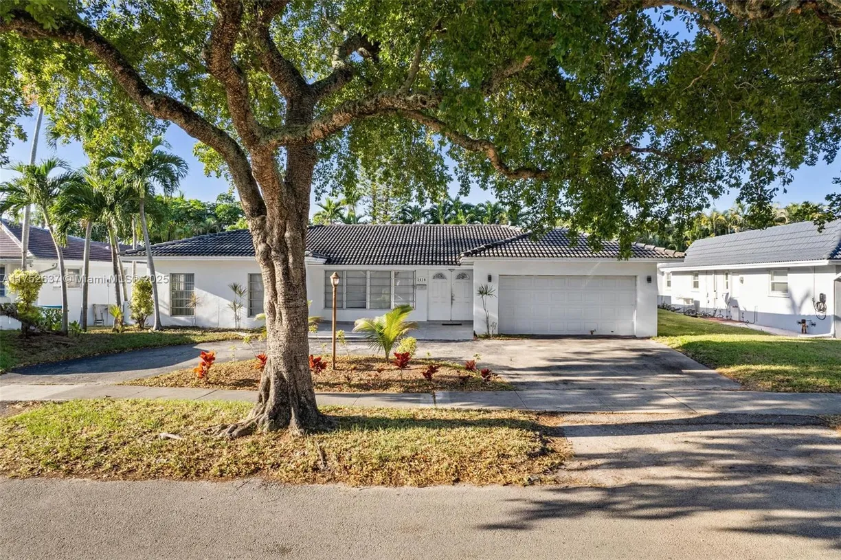 South Florida Real Estate | View 3610 N 53rd Ave | 4 Beds, 3 Baths