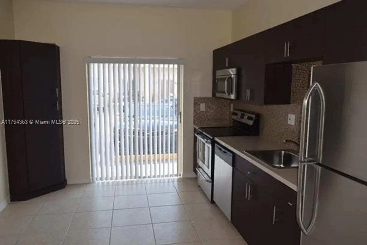 South Florida Real Estate | View 6912 NW 179th St, 109-3 | 3 Beds, 2 Baths
