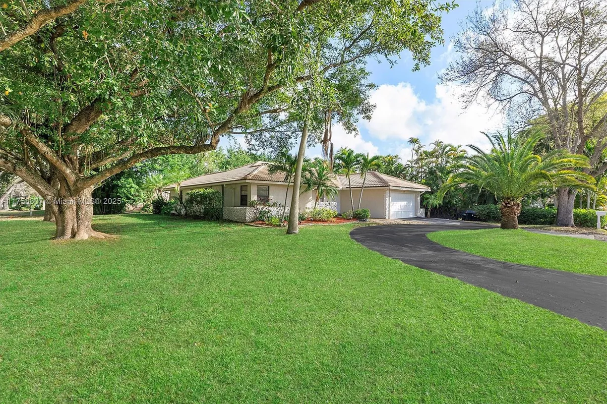 South Florida Real Estate | View 11085 NW 15th St | 4 Beds, 2 Baths
