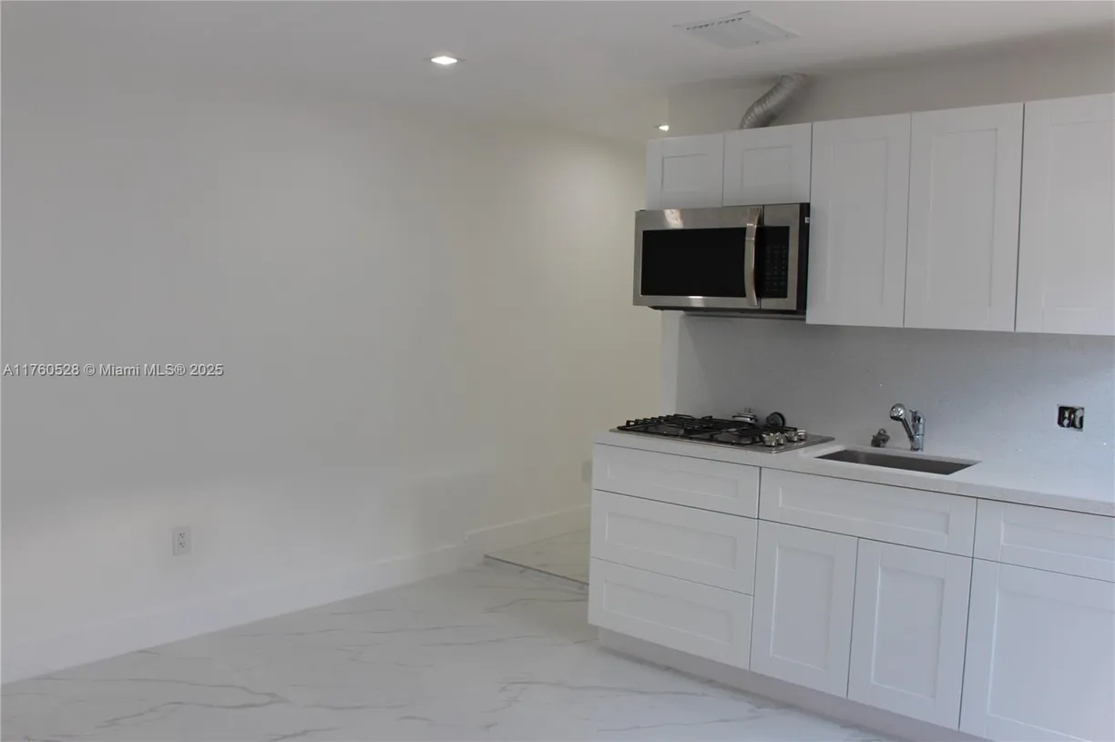 South Florida Real Estate | View 540 E 37th St, 2 | 2 Beds, 1 Bath