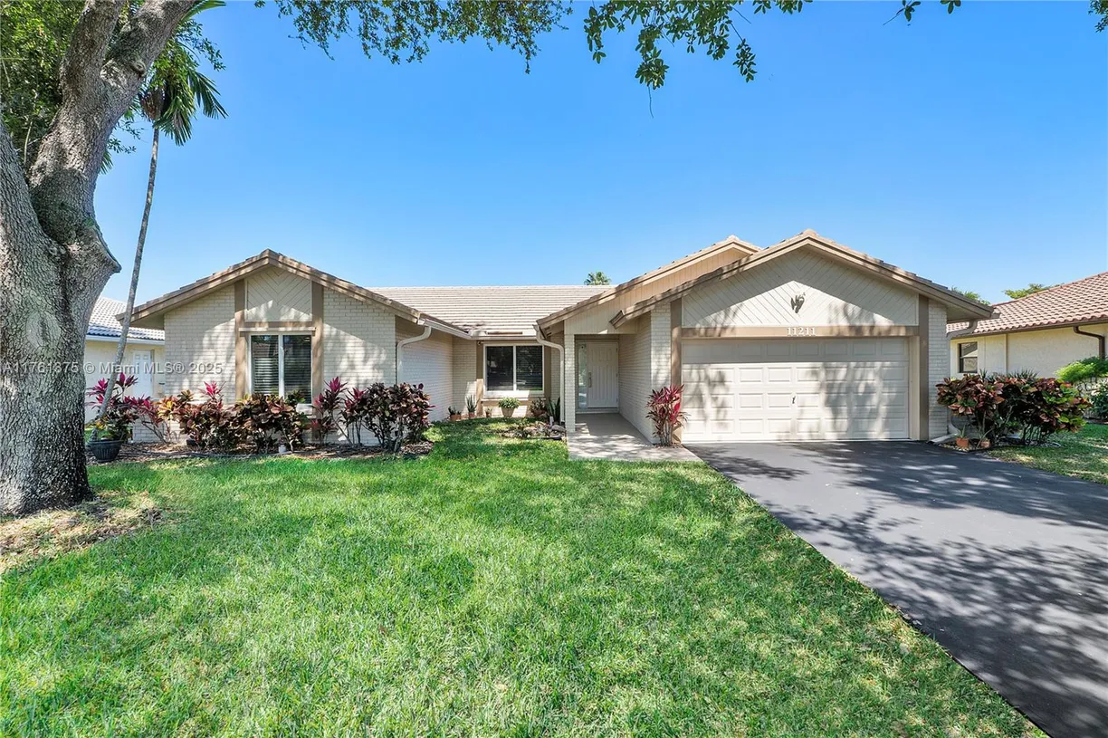 South Florida Real Estate | View 11211 NW 15th St | 4 Beds, 2 Baths