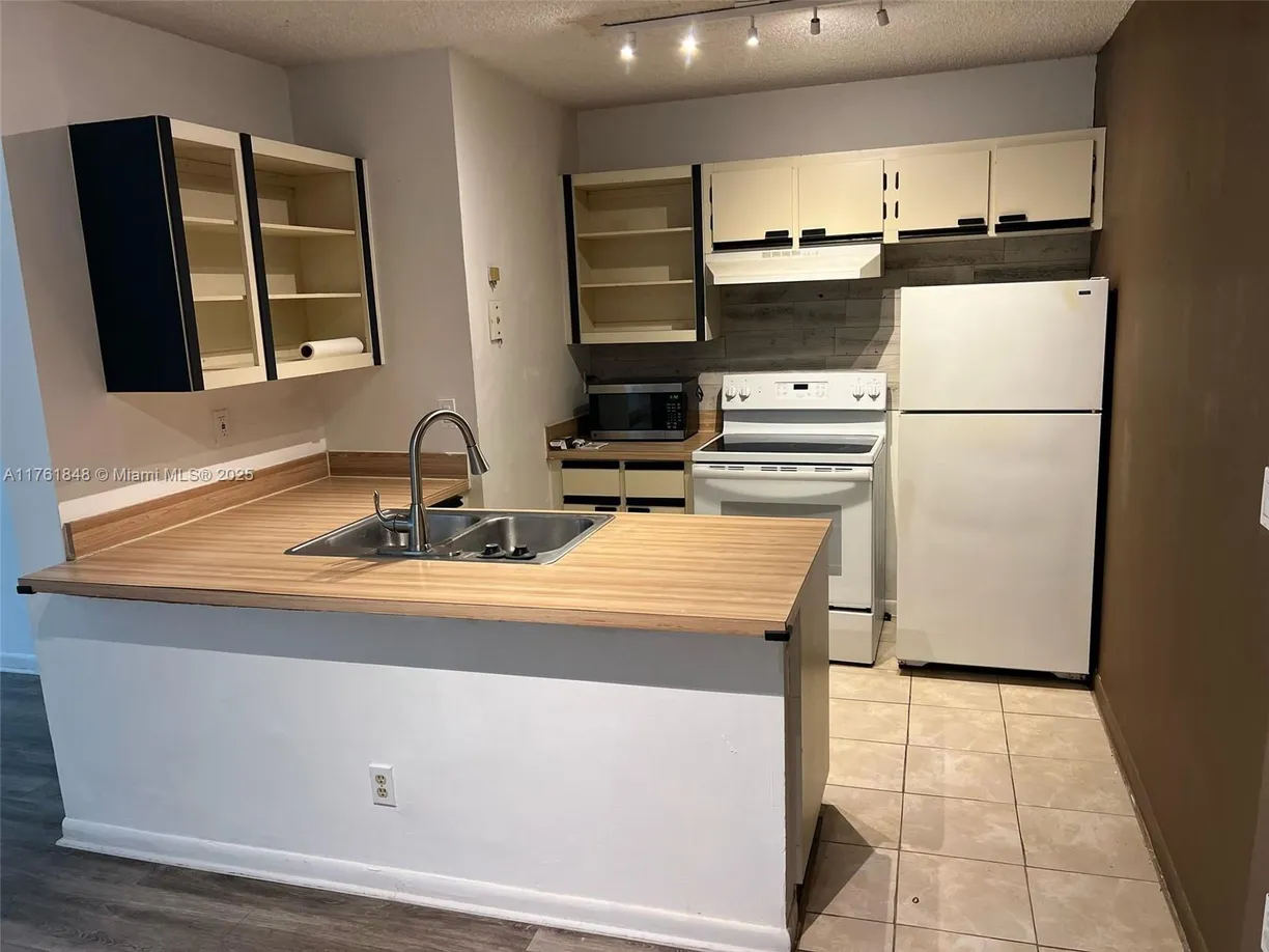 South Florida Real Estate | View 18328 NW 68th Ave, L | Listing