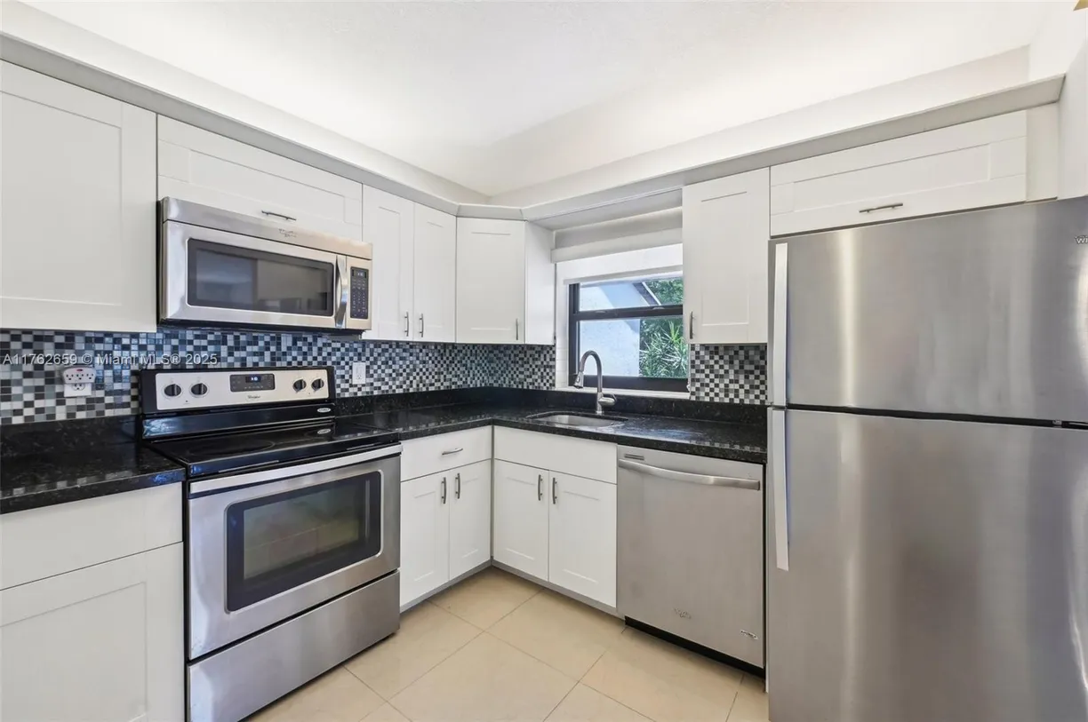 South Florida Real Estate | View 2613 N Carambola Cir N, 18100 | 2 Beds, 2 Baths