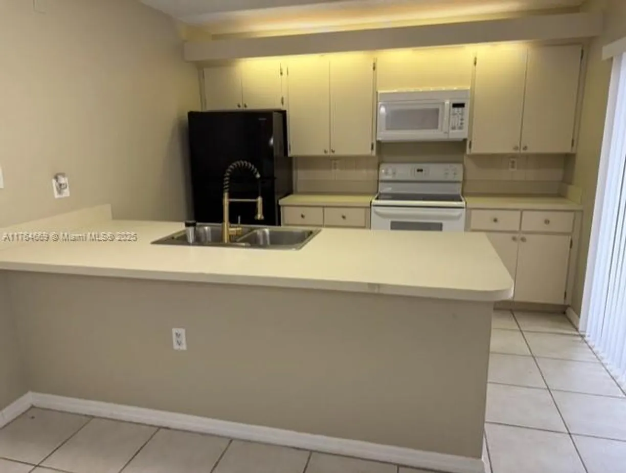 South Florida Real Estate | View 7617 76th Way | 2 Beds, 2 Baths