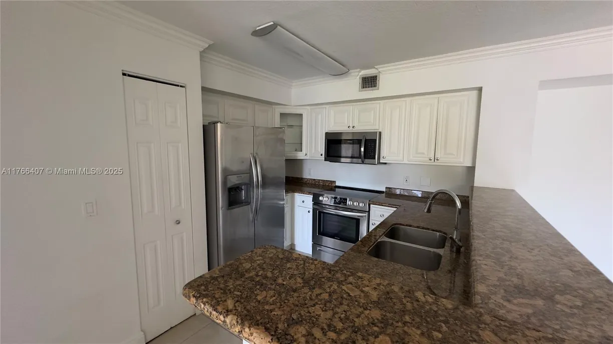 South Florida Real Estate | View 12166 Saint Andrews Pl, 106 | Listing