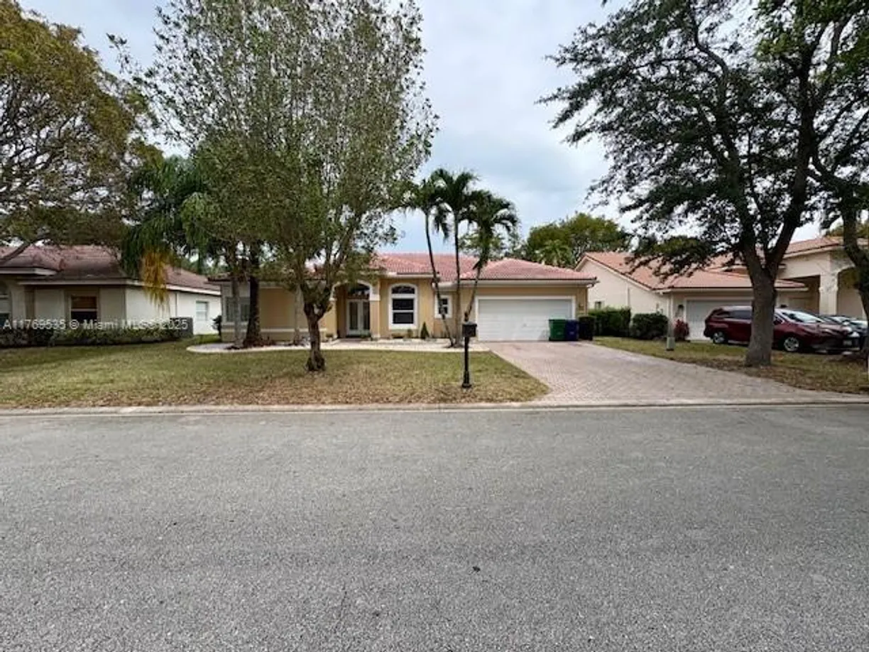 South Florida Real Estate | View 10261 NW 54th Pl | 4 Beds, 3 Baths