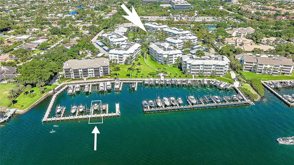 South Florida Real Estate | View 1015 S Bay Colony Drive S, & Slip 17 | 2 Beds, 2 Baths