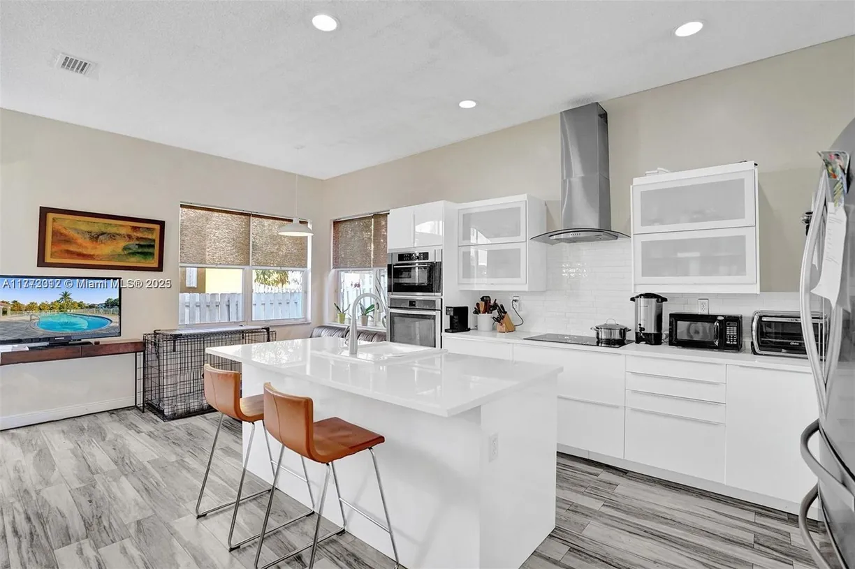 South Florida Real Estate | View 3819 SW 51st St | 4 Beds, 2 Baths