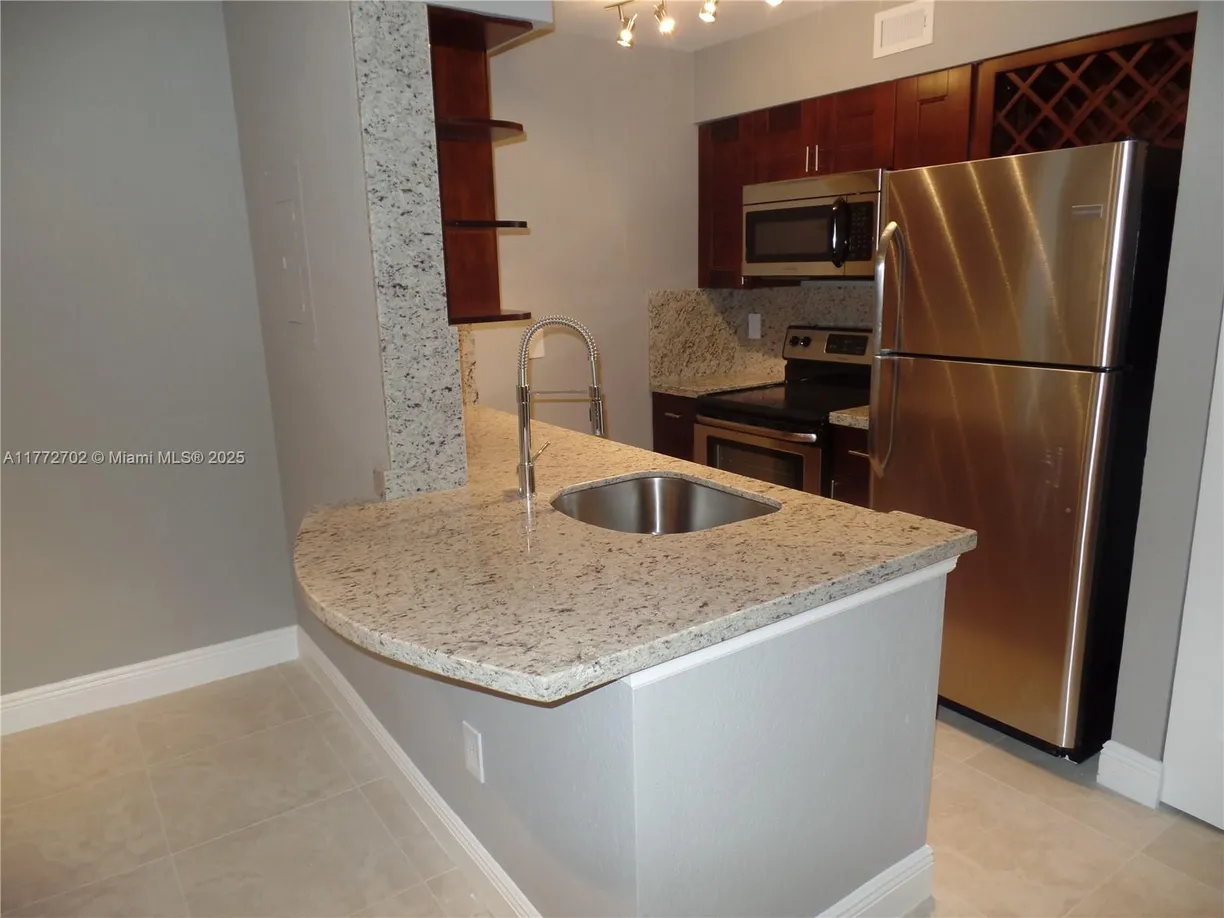 South Florida Real Estate | View 2880 N Oakland Forest Dr, 213 | Listing