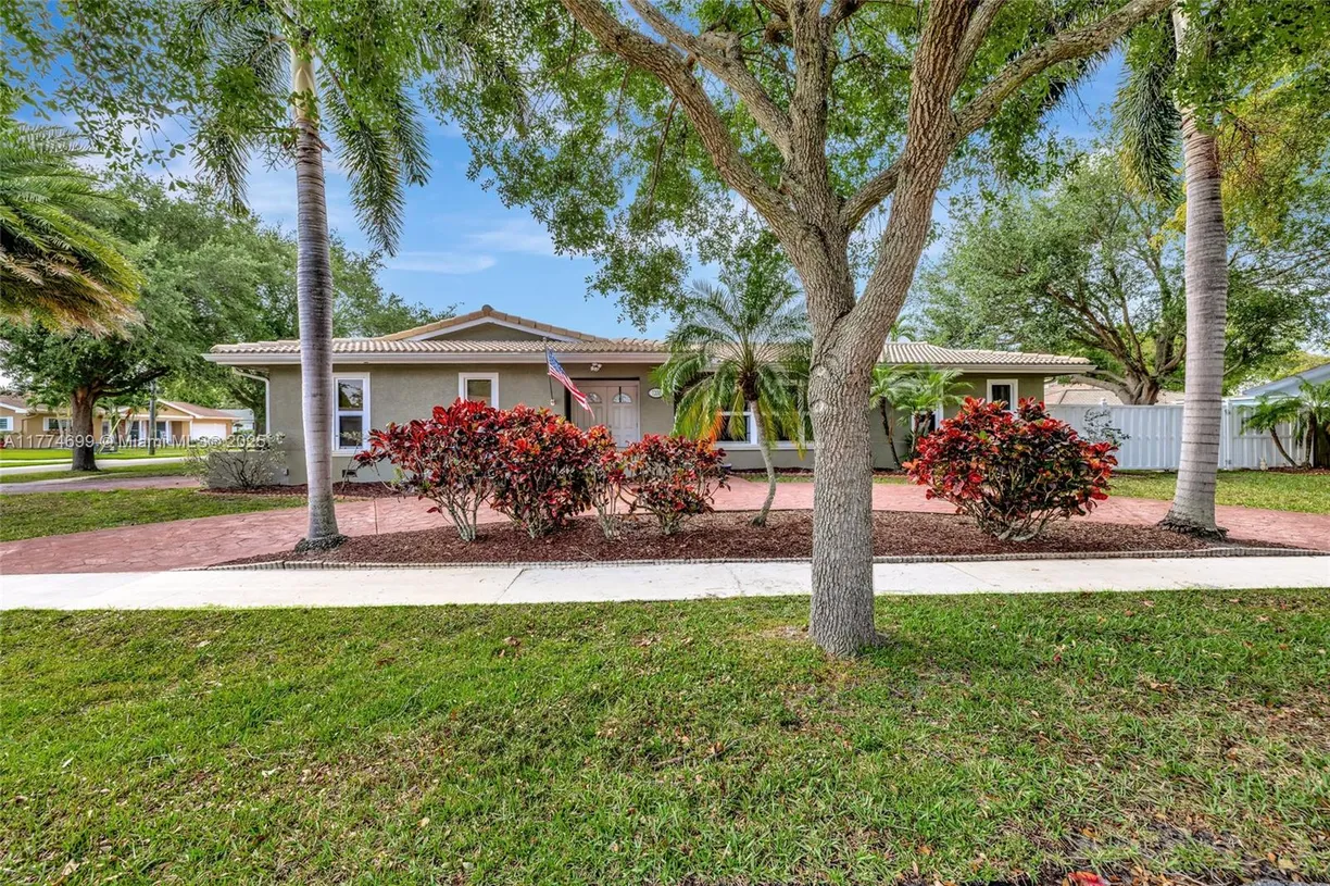 South Florida Real Estate | View 7200 NW 9th St | 4 Beds, 2 Baths