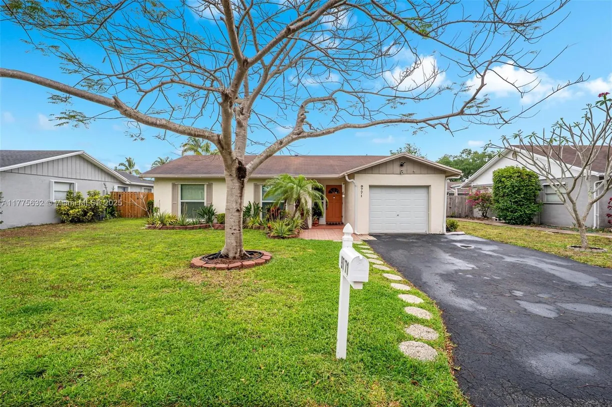 South Florida Real Estate | View 9771 NW 23rd St | 3 Beds, 2 Baths