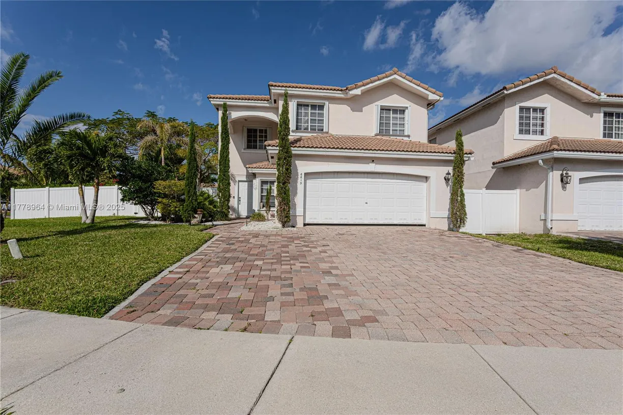 South Florida Real Estate | View 6615 Adriatic Way | 4 Beds, 2 Baths