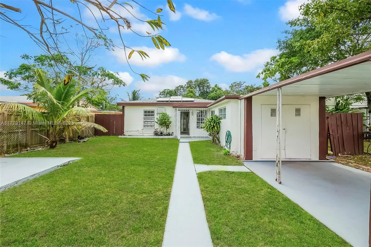 South Florida Real Estate | View 320 NW 117th St | 4 Beds, 2 Baths