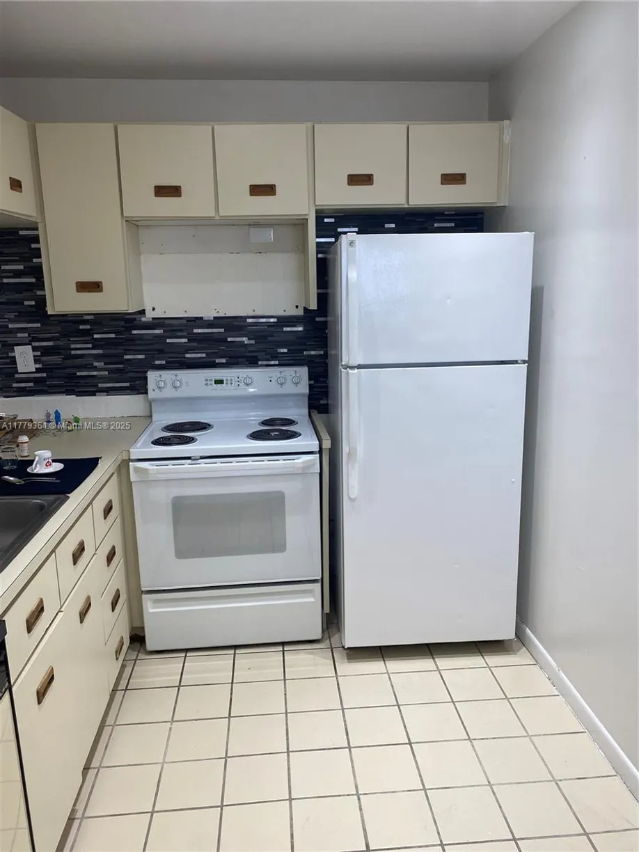 South Florida Real Estate | View 2720 W 63rd Pl, 203 | Listing