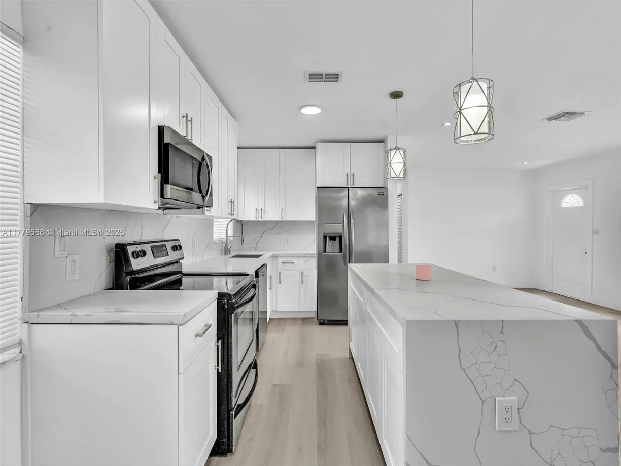 South Florida Real Estate | View 3431 NW 6th Ct | 4 Beds, 2 Baths
