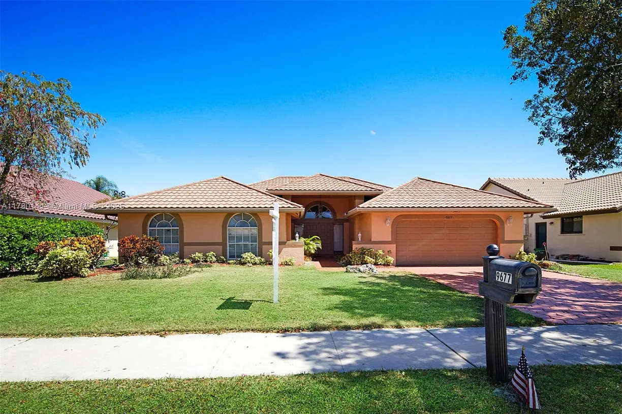 South Florida Real Estate | View 9677 N Springs Way | 4 Beds, 2 Baths