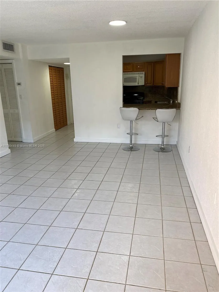 South Florida Real Estate | View 1300 W 47th Pl, 118 | 1 Bed, 1 Bath