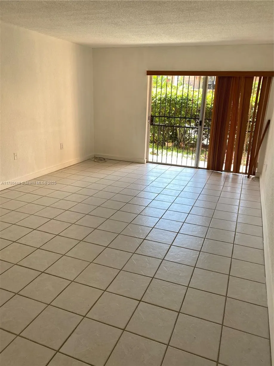 South Florida Real Estate | View 1300 W 47th Pl, 118 | Listing