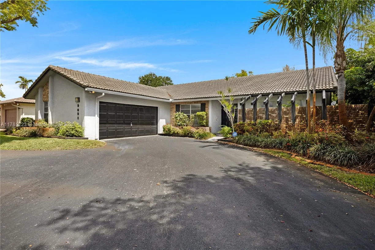 South Florida Real Estate | View 9091 NW 12th St | 4 Beds, 2 Baths