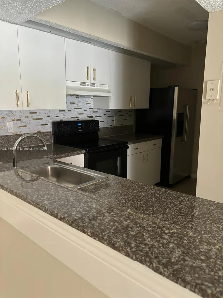 South Florida Real Estate | View 18860 NW 57th Ave, 302 | 2 Beds, 2 Baths