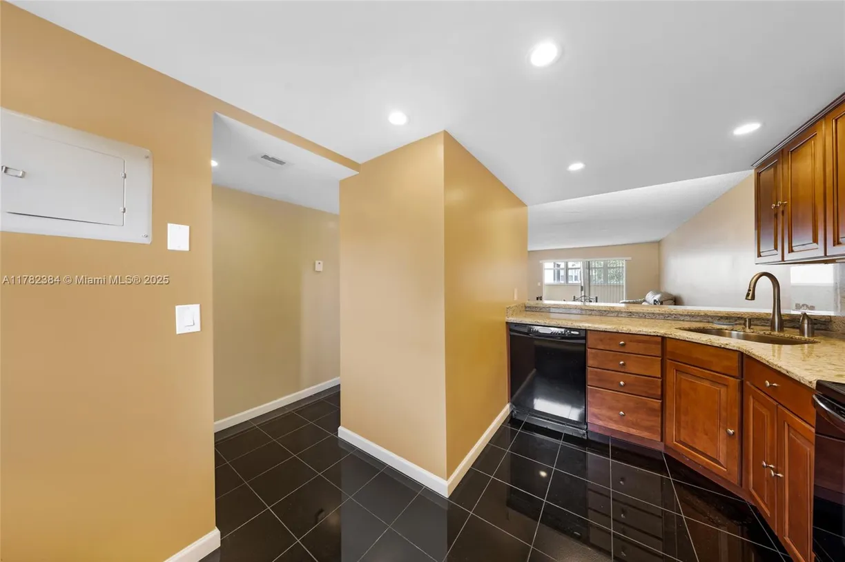 South Florida Real Estate | View 6075 N Sabal Palm Blvd, 210 | Listing
