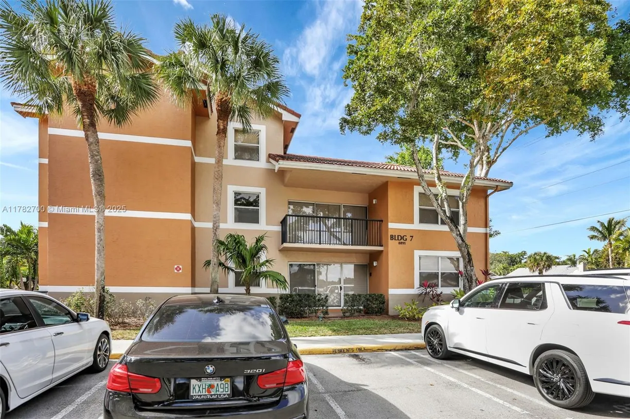 South Florida Real Estate | View 8891 Wiles Rd, 102 | 3 Beds, 2 Baths