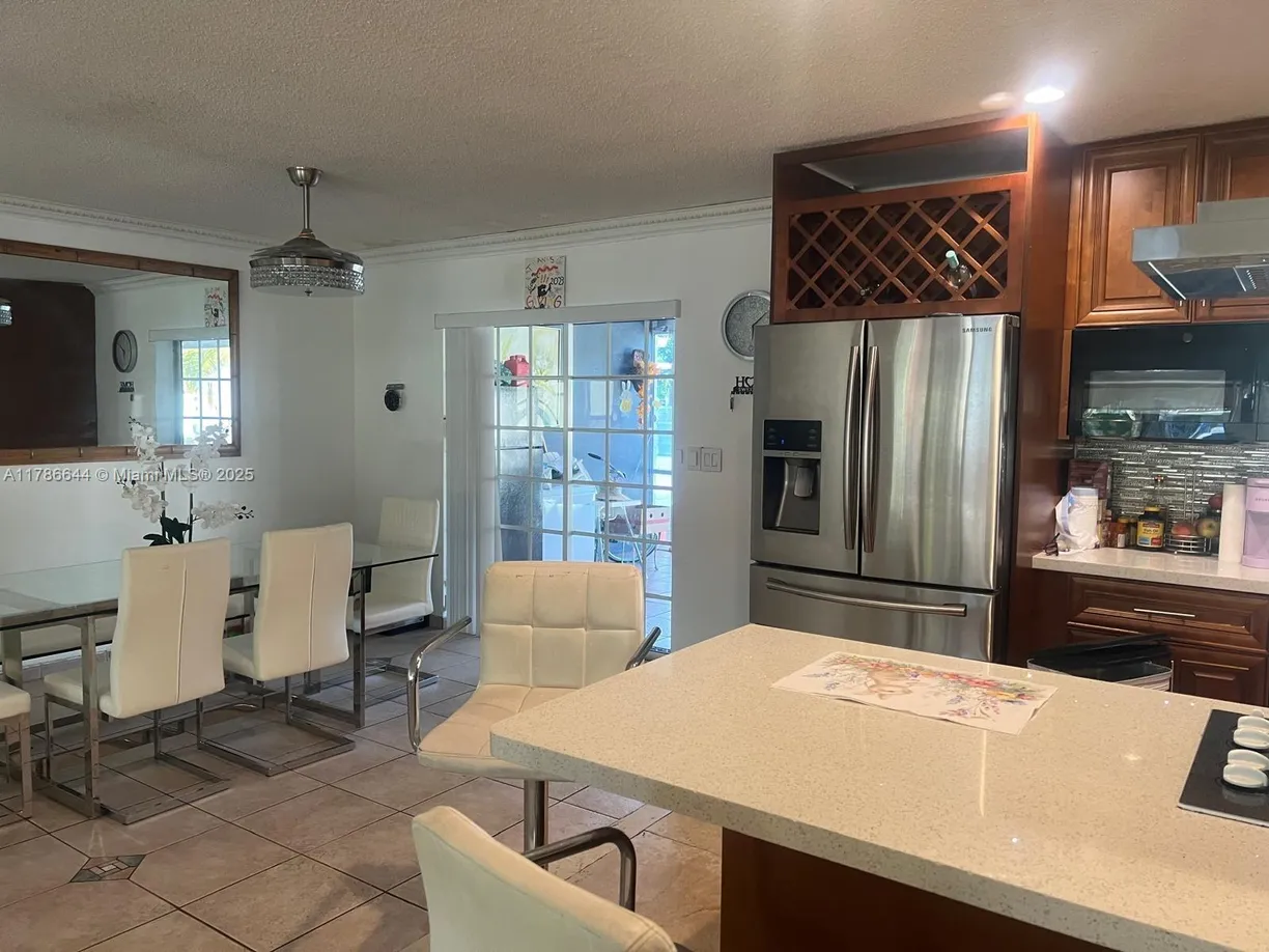 South Florida Real Estate | View 5001 Madison St | 5 Beds, 4 Baths