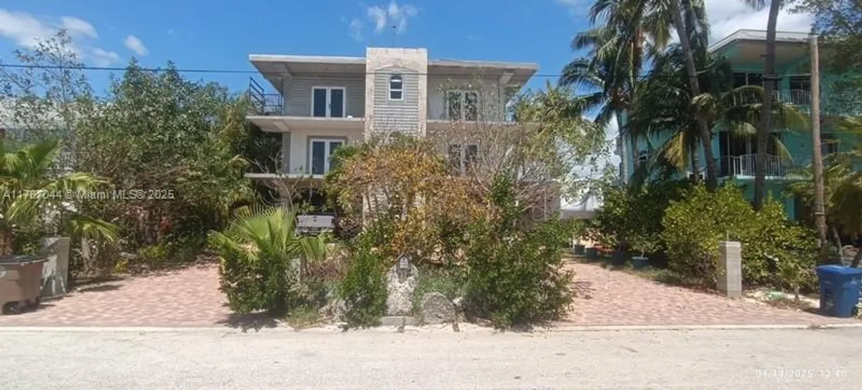 South Florida Real Estate | View 214 Hibiscus Ave | 5 Beds, 4 Baths