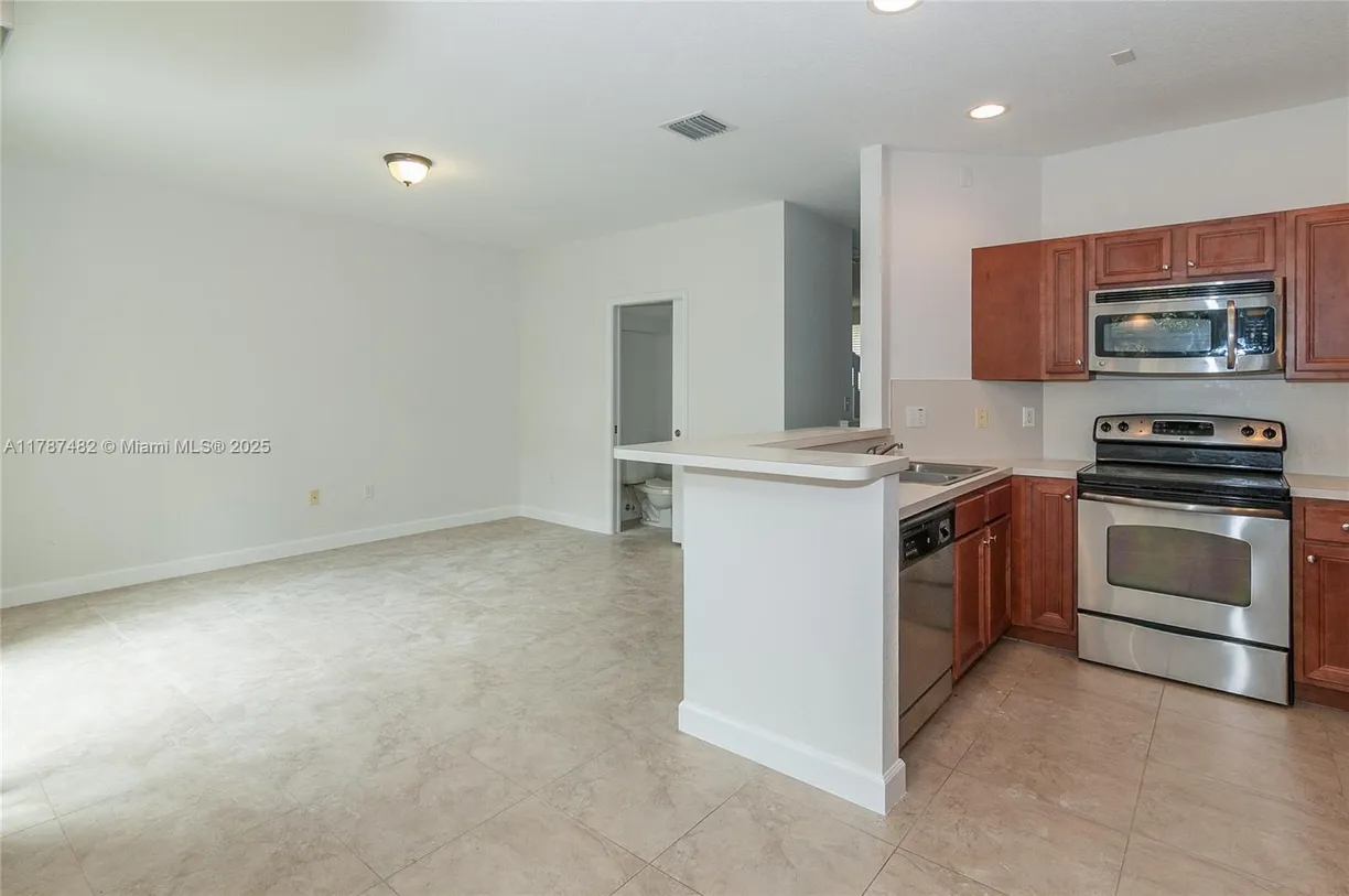 South Florida Real Estate | View 1028 NE 207th Ter, 1028 | Listing