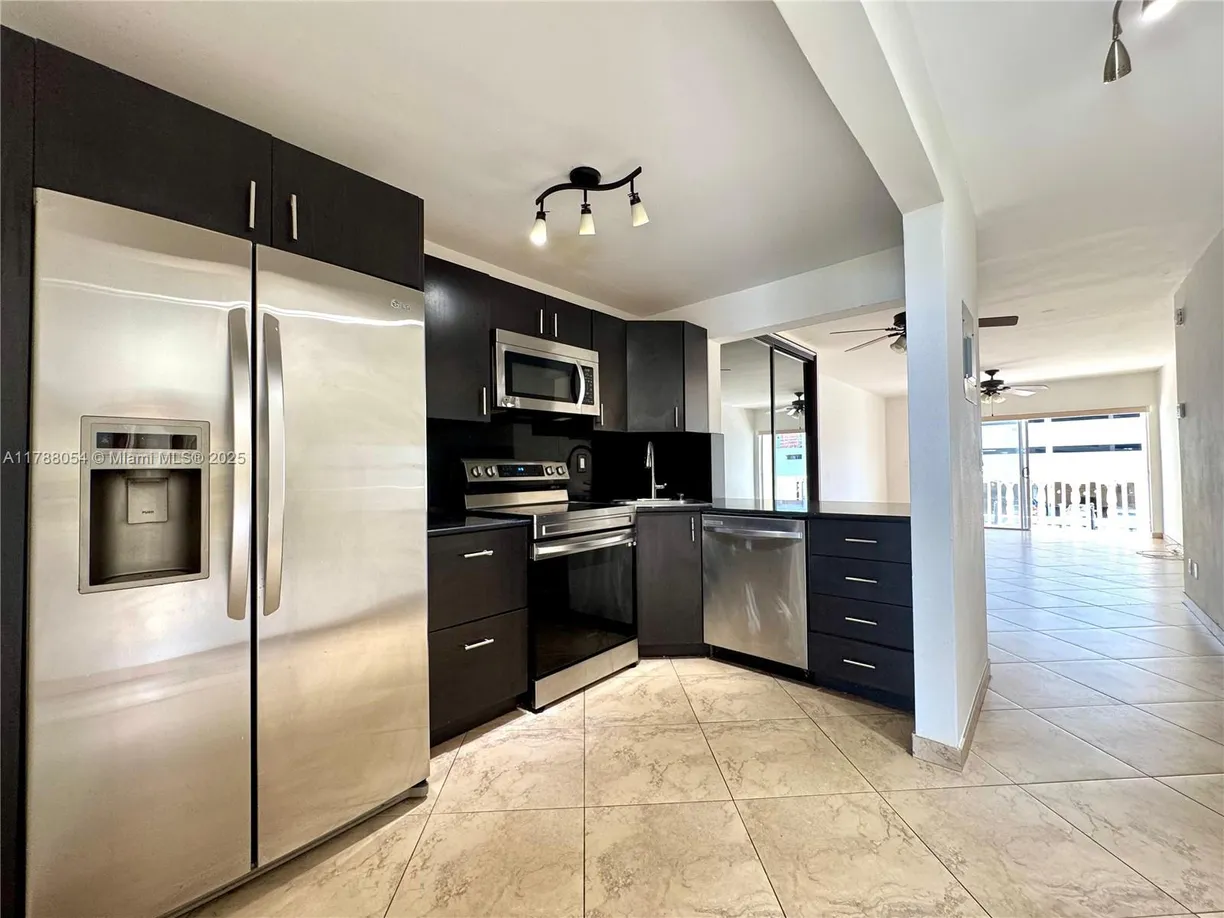 South Florida Real Estate | View 450 E Paradise Isle Blvd, 208 | Listing
