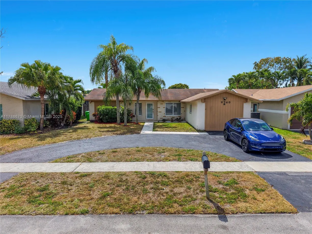 South Florida Real Estate | View 9340 NW 43rd Mnr | 4 Beds, 2 Baths